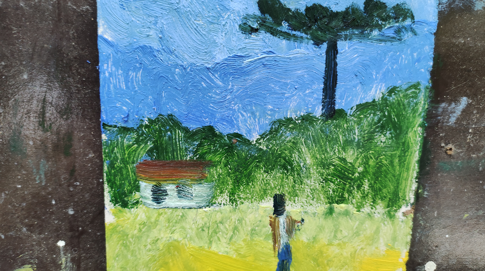 Pintura de uma paisagem feita por aluno